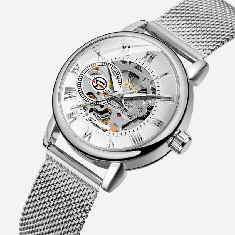 Srebrny szkieletowy zegarek damski z rzymskimi cyframi i siatkową bransoletą