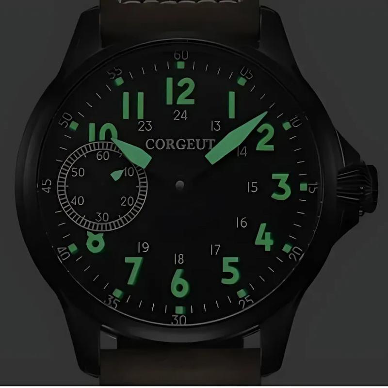 Czarny zegarek z mechanizmem ręcznym, zielone podświetlenie cyfr i wskazówek