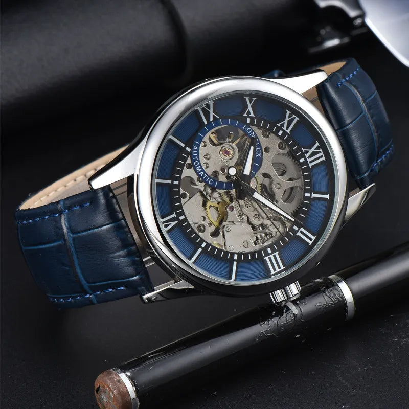 Srebrny szkieletowy zegarek automatyczny z niebieską tarczą i paskiem z granatowej skóry